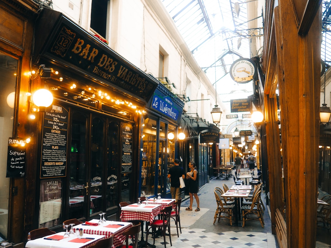 Explore the Rainy day photoshoot Paris Eiffel Tower near covered passages for iconic views.